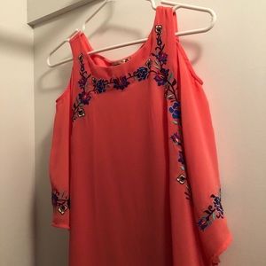 Coral shoulder cut out dress with flowers.